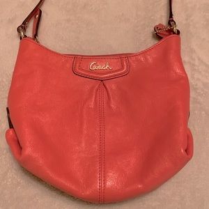 *Slightly used orange Coach small purse.